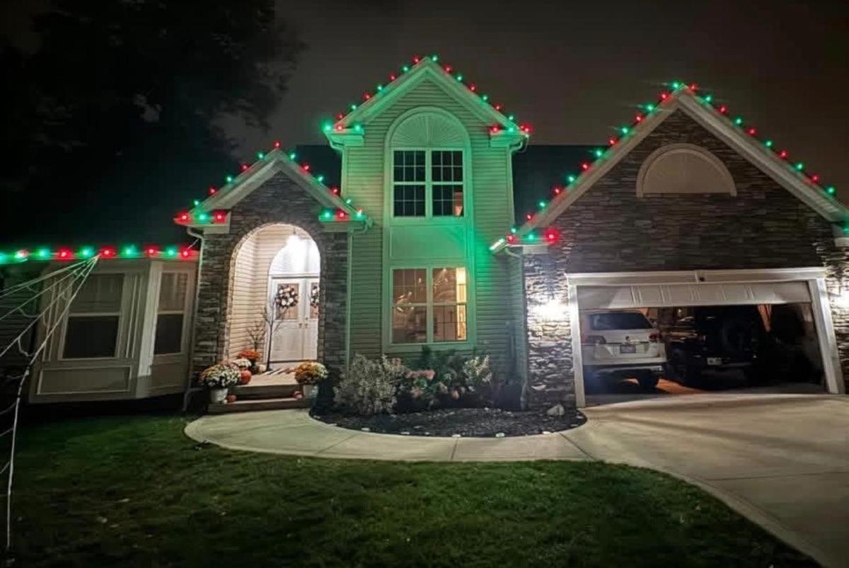Home with red and green roofline lights