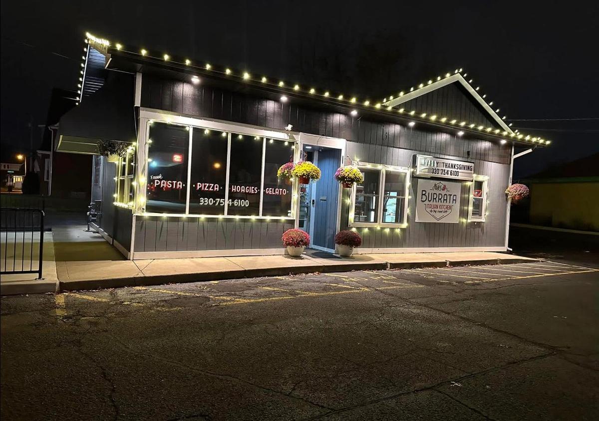 Storefront with warm white roofline and window lights